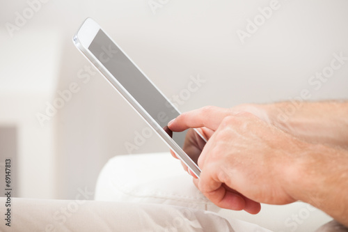 Man Touching Smartphone At Home