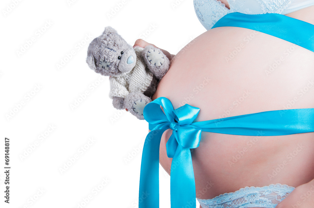 Pregnant belly with blue ribbon