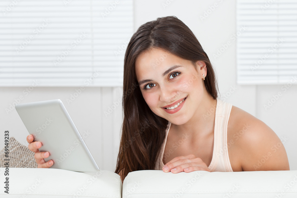 Beautiful Woman Holding Digital Tablet On Sofa Beautiful Woman Holding Digital Tablet On Sofa