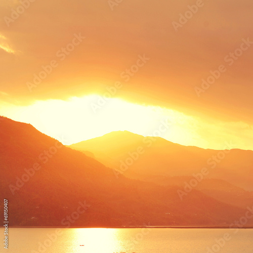 calm evening landscape with lake and mountains