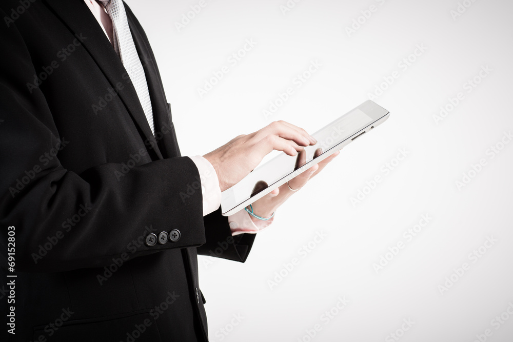 Asian business man using tablet computer isolated on white backg Asian business man using tablet computer isolated on white backg