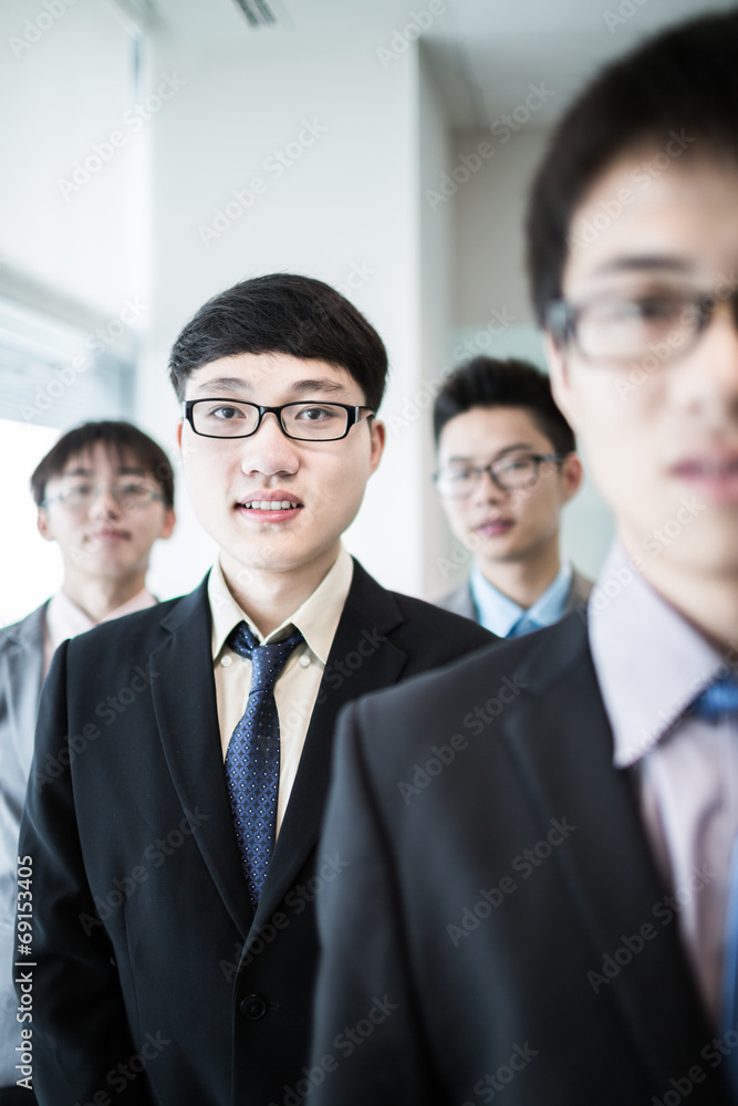 Group of business people with businessman leader on foreground Group of business people with businessman leader on foreground
