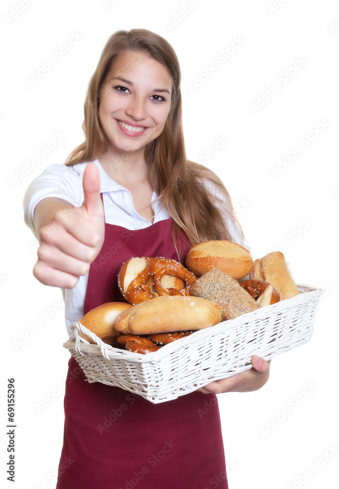Blonde Bäckereiverkäuferin zeigt den Daumen hoch