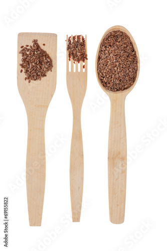 Wooden spoon, fork, paddle with flax seed