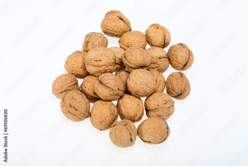 walnuts heap isolated on white background walnuts heap isolated on white background