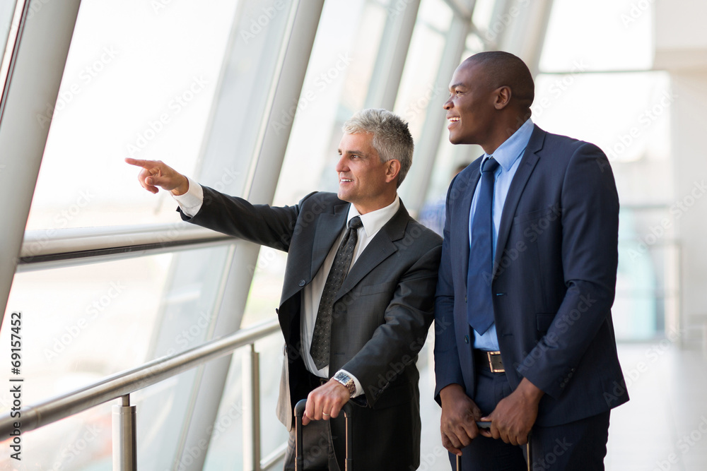 business travelers pointing at airport business travelers pointing at airport