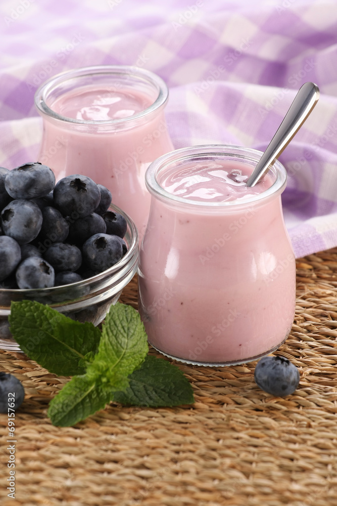 yogurt with blueberries in a glass jar and blueberries in a glas yogurt with blueberries in a glass jar and blueberries in a glas