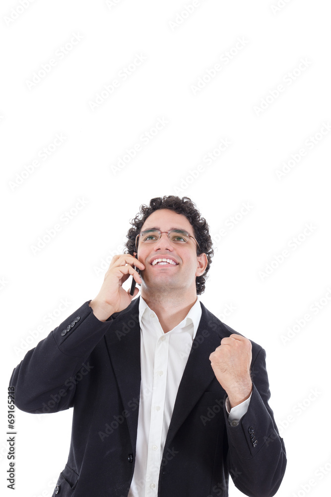 man in a suit talking on the mobile and shows a sign of success man in a suit talking on the mobile and shows a sign of success