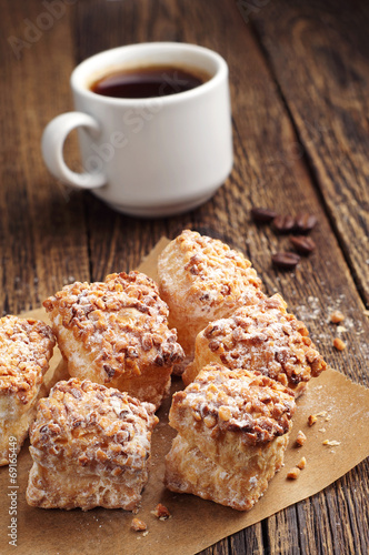 Sweet puff cookies with nuts and coffee