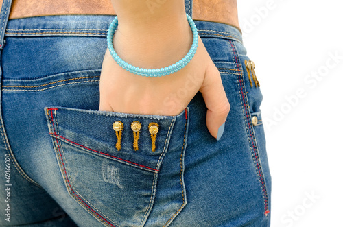 hand with a bracelet in a pocket