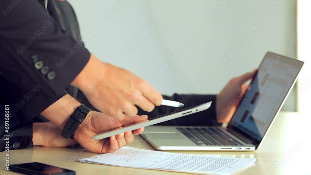 close-up of a young businessman showing a business plan close-up of a young businessman showing a business plan
