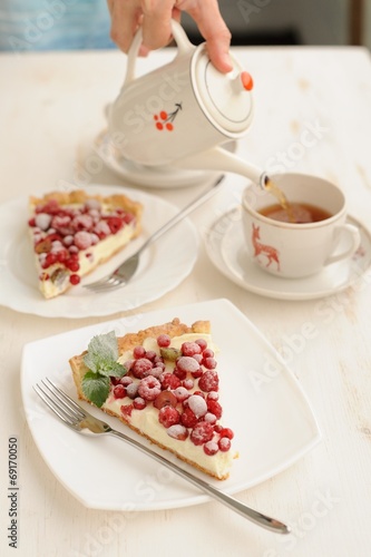 Two pieces of berry pie with whipped cream filling