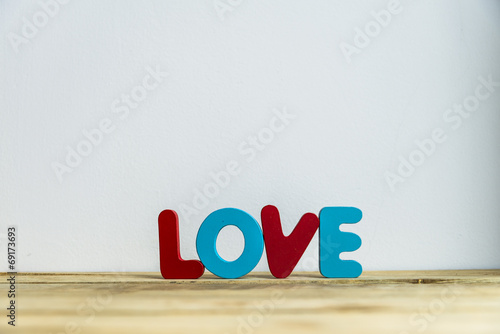 Colorful wooden word Love with white background6 photo