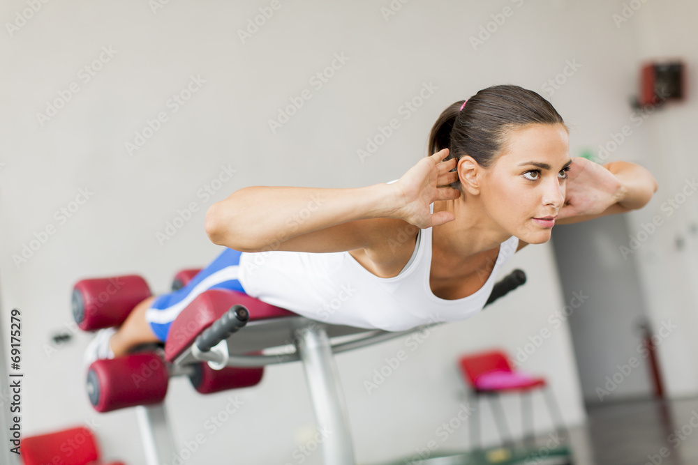 Young woman training in the gym Young woman training in the gym