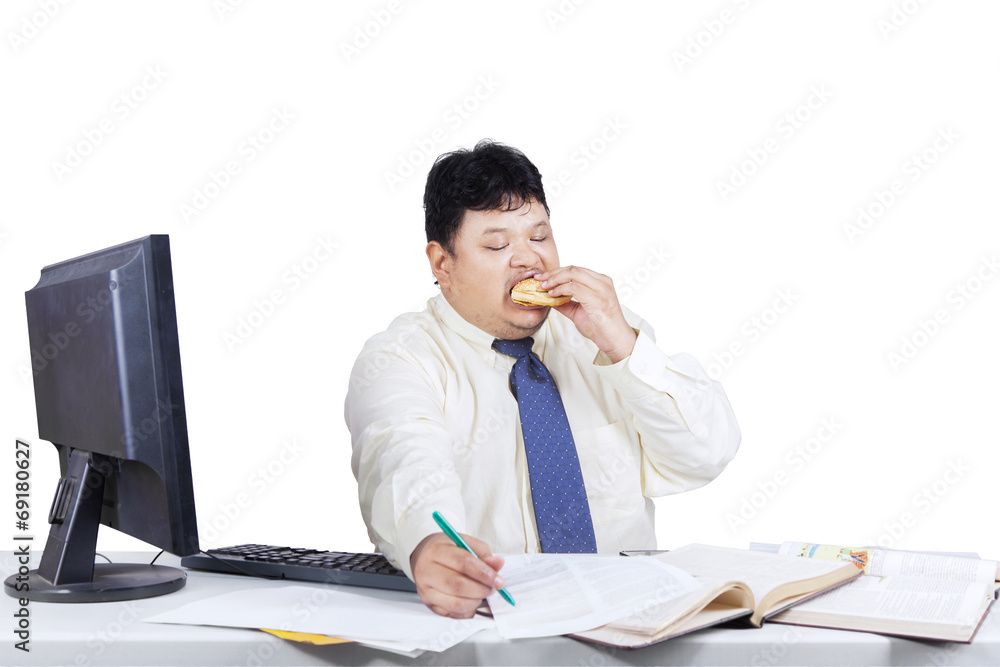 Fat businessman working while eating 1 Fat businessman working while eating 1