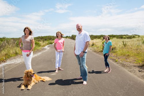 A happy family on a quiet country road