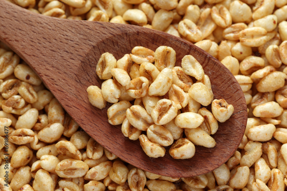 Honey cereal in a wooden spoon Honey cereal in a wooden spoon