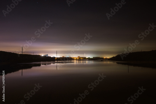 Night city lights over the lake