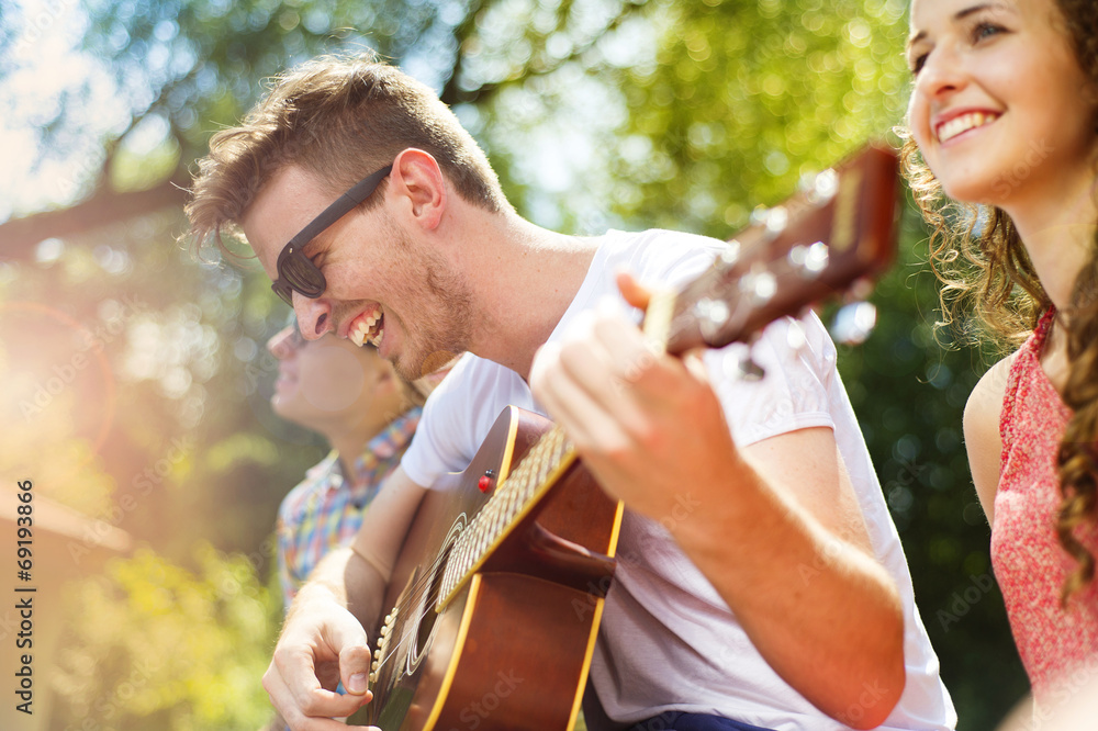 Fototapeta premium Friends having fun with guitar