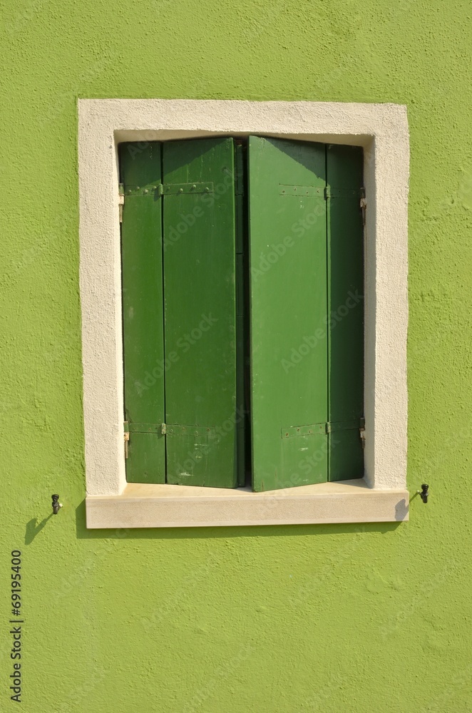 Green window in Burano, Venice, Italy
