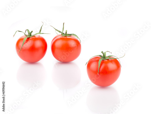 Three fresh ripe tomatoes.
