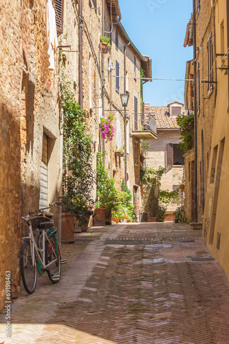 Sunny streets of Italian city Pienza in Tuscany