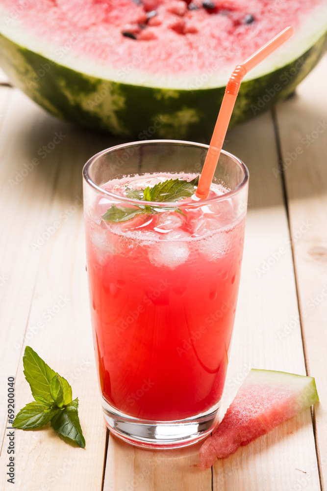 Freshly squeezed watermelon juice with mint and ice cubes Freshly squeezed watermelon juice with mint and ice cubes