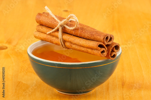 Honey and cinnamon in bowl