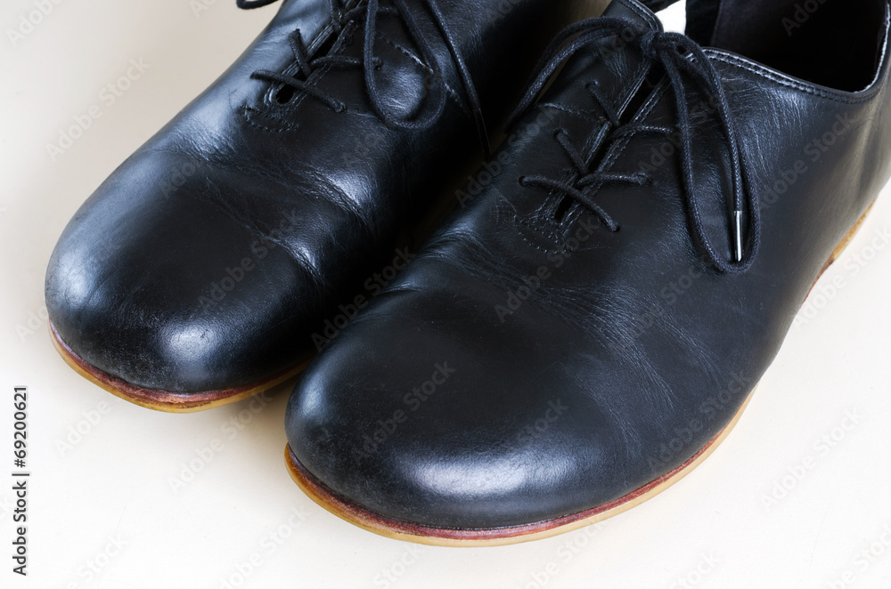 Black male leather shoes on white background