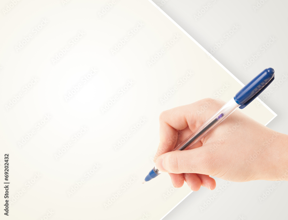 Hand writing on plain empty white paper copy space Hand writing on plain empty white paper copy space