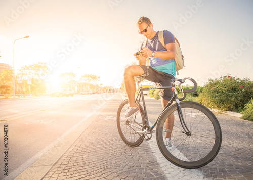 Man on bicycle at sunset