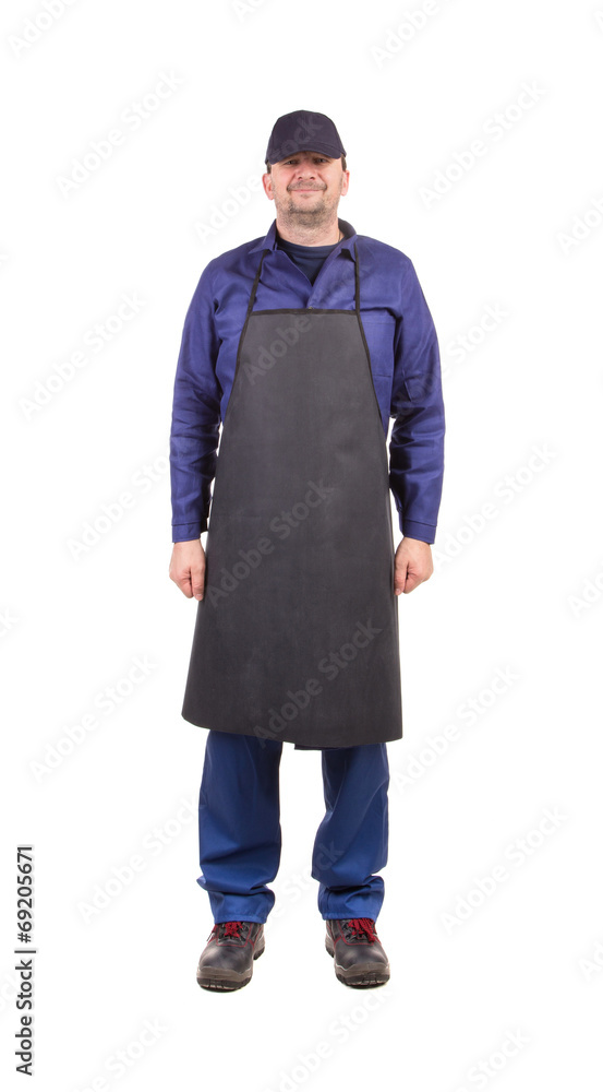 Worker wearing black apron.