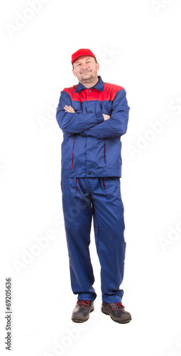 Worker in red-blue workwear. © indigolotos