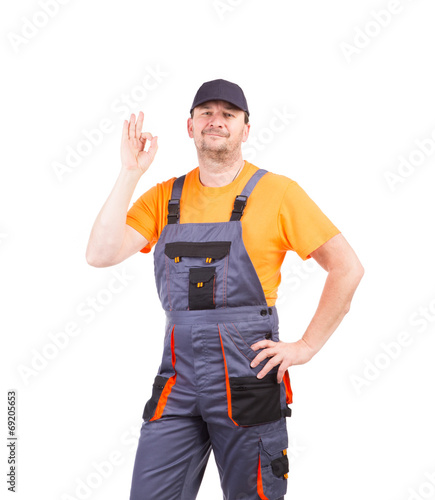 Happy worker wearing overalls.