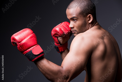 Training his boxing skills. © gstockstudio