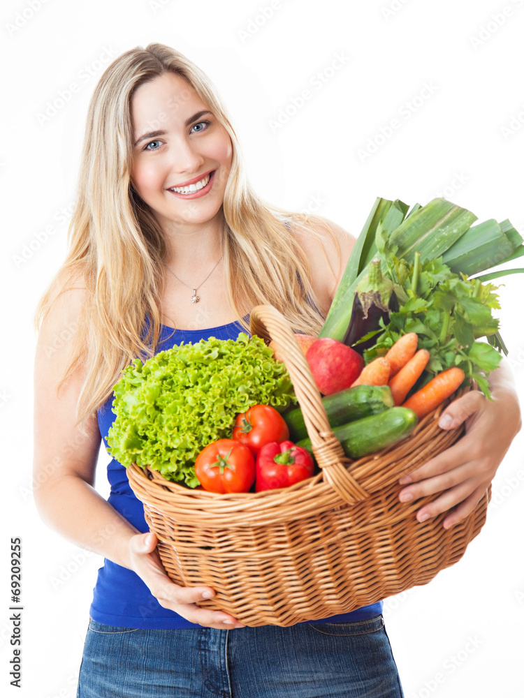 Young healthy beautiful woman with a basket full of fresh vegeta Young healthy beautiful woman with a basket full of fresh vegeta