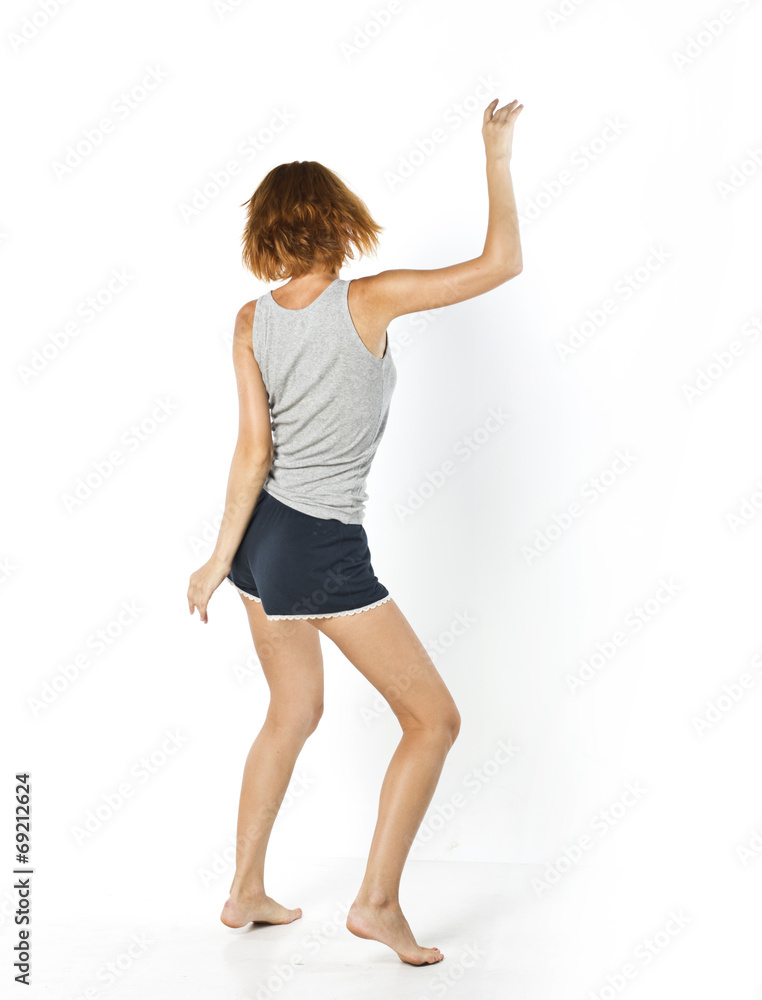 beautiful slender girl dancing on a white background