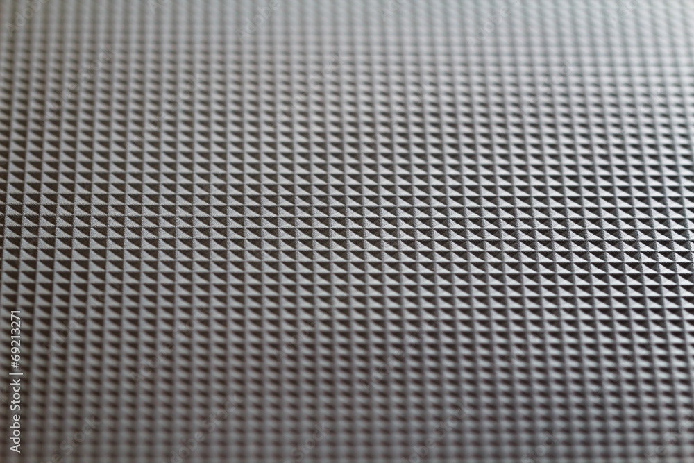Structure from identical squares on black plastic Structure from identical squares on black plastic