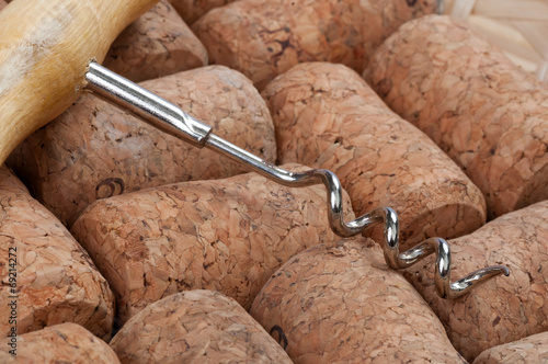 Corkscrew with wooden handle and cork photo