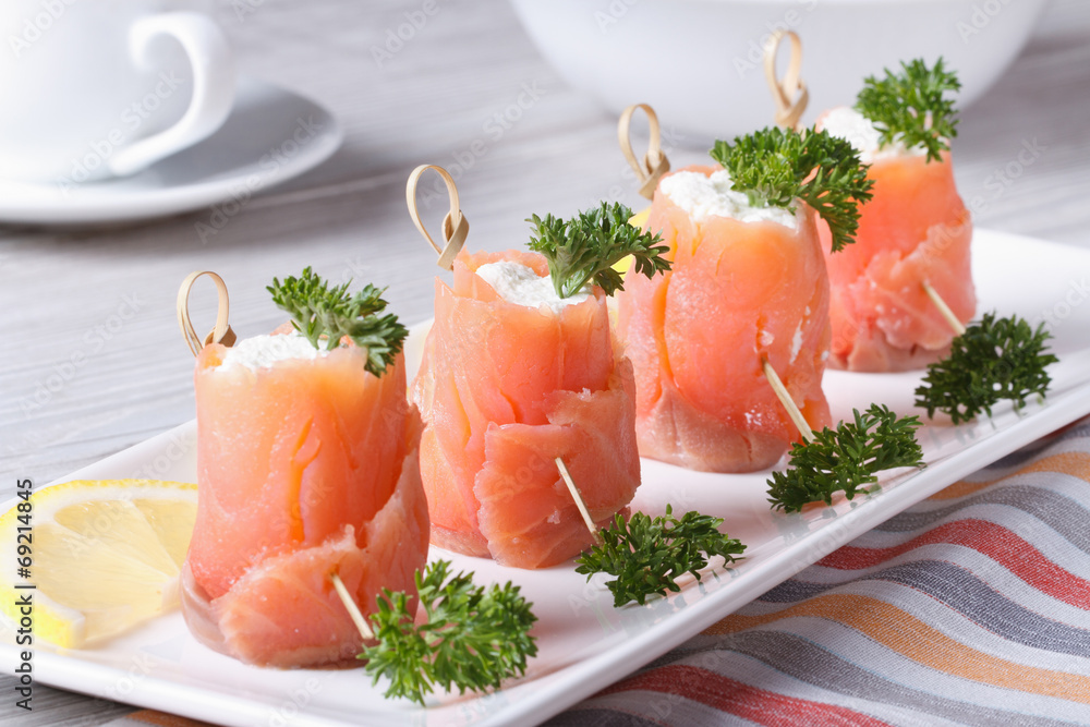 Rolls of salmon with cream cheese close-up horizontal Rolls of salmon with cream cheese close-up horizontal