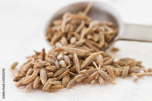 cumin seeds and spoon