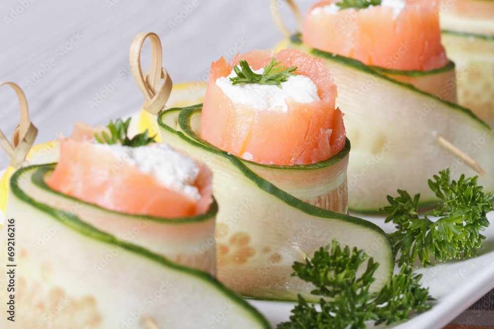 cucumber rolls with salmon, cream cheese macro horizontal cucumber rolls with salmon, cream cheese macro horizontal
