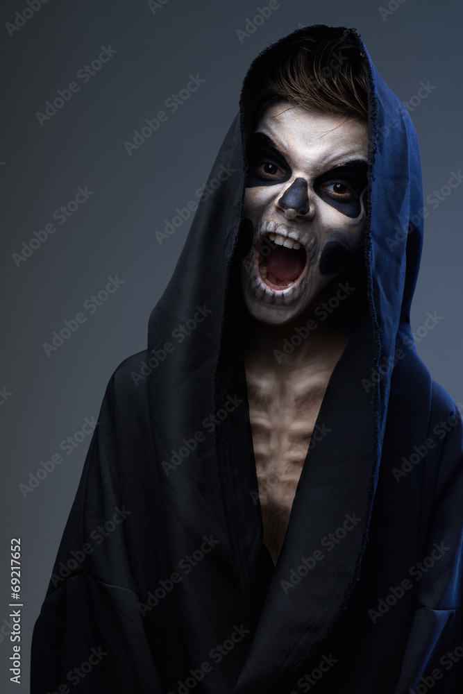 teenager with makeup skull cape teenager with makeup skull cape