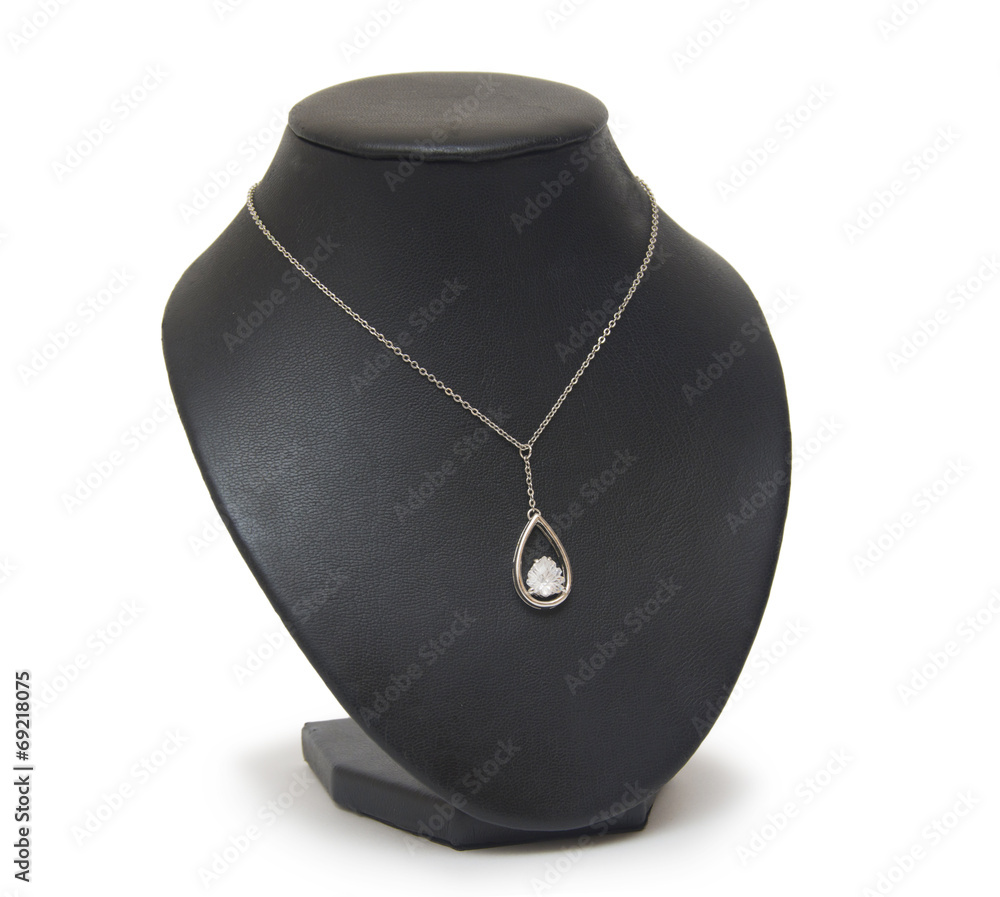 Diamond necklace on black mannequin isolated on white background Diamond necklace on black mannequin isolated on white background