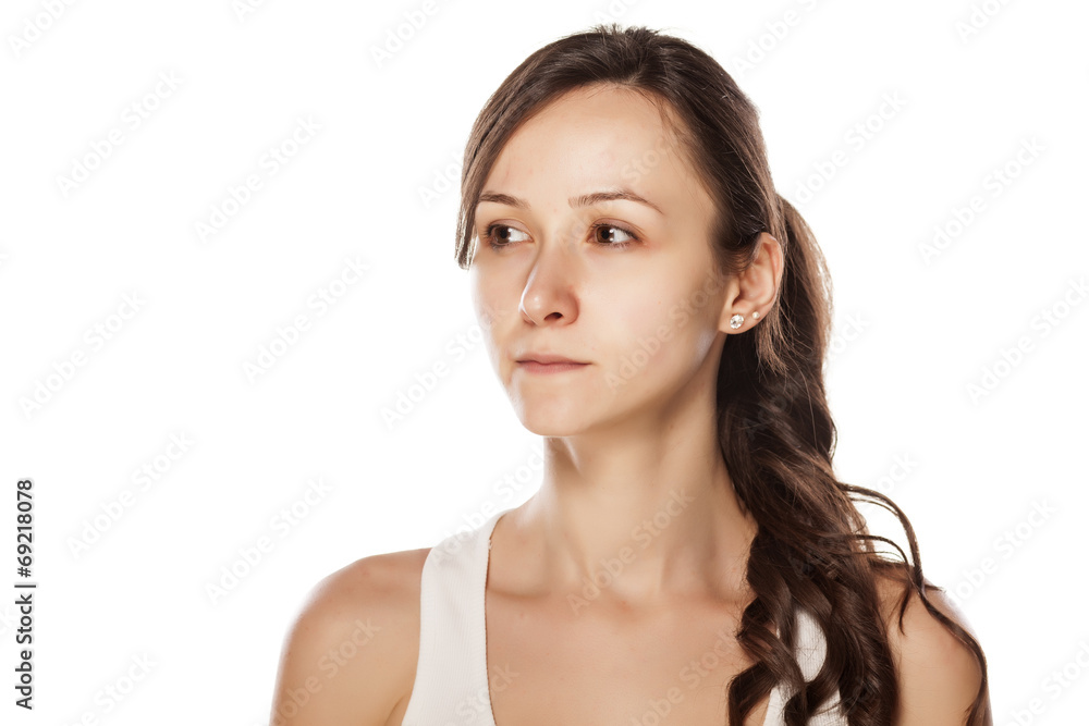 portrait of a serious young woman without make-up
