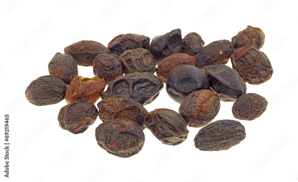 Group of saw palmetto berries on a white background. Group of saw palmetto berries on a white background.
