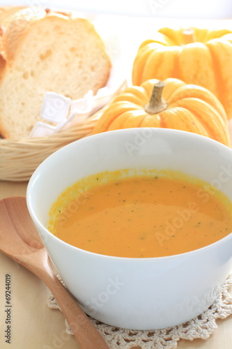 Homemade pumpkin soup with french bread