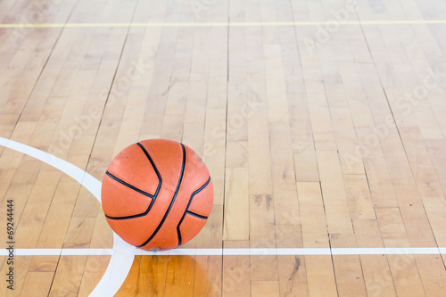 Basketball ball over floor in the gym