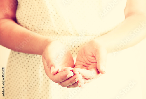 closeup of young woman hands. hands outstretched in cupped shape