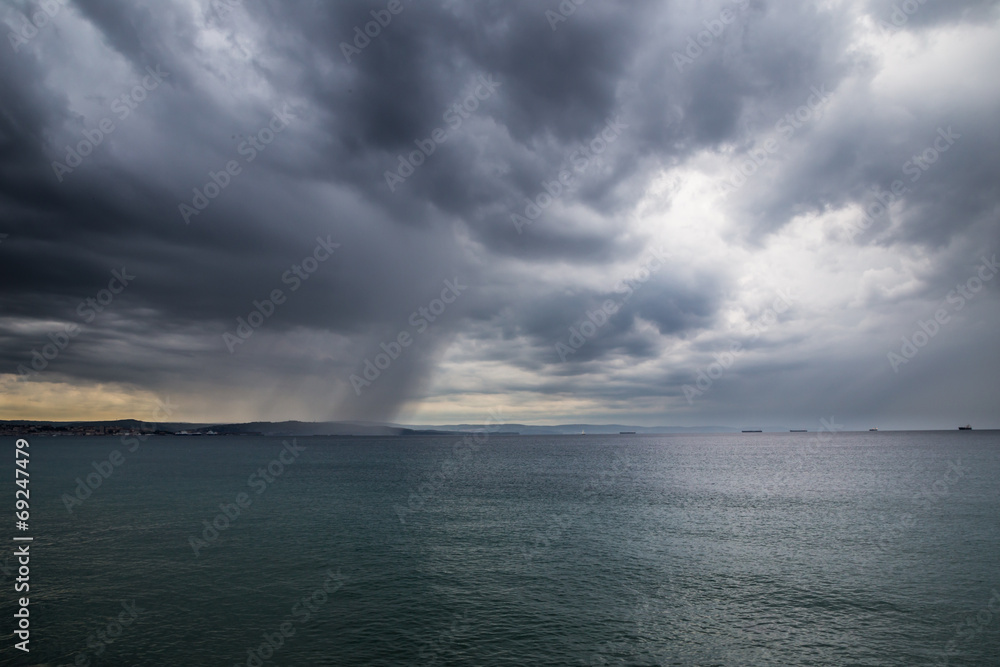 A storm in the sea in front of the city A storm in the sea in front of the city